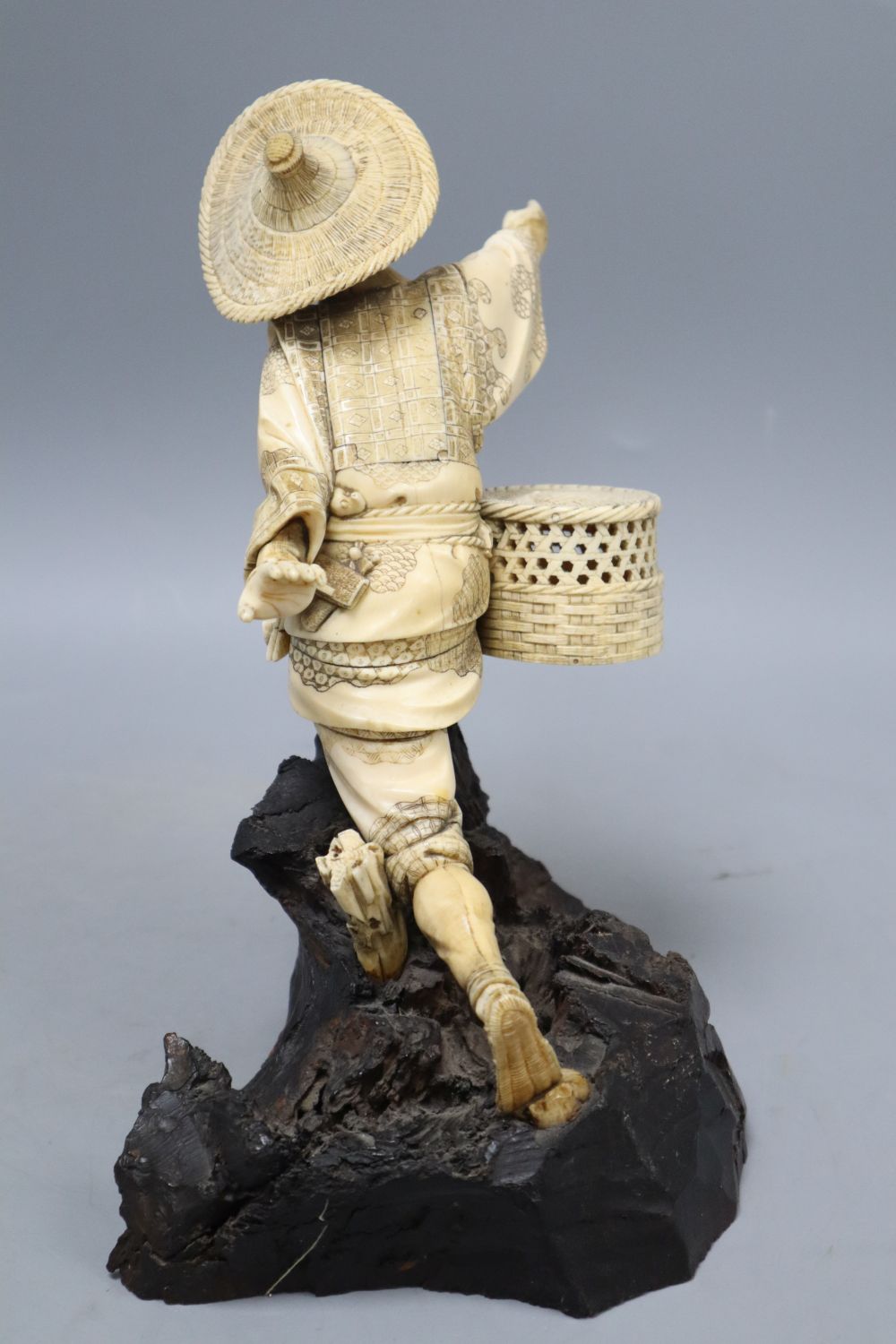 A Japanese Meiji ivory figure of a fisherman, height 26cm